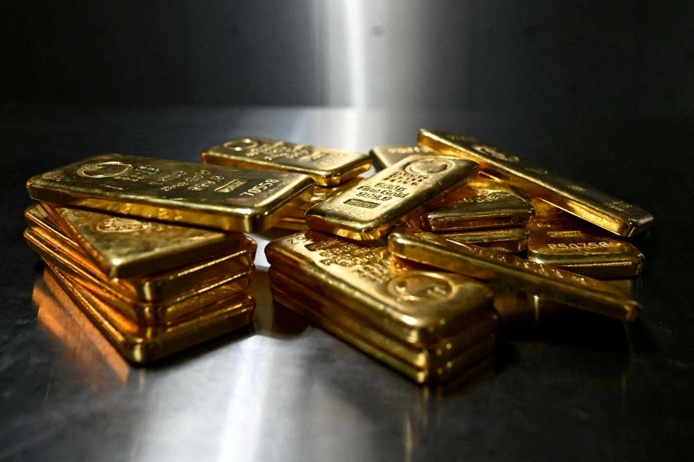 Gold eases from seven-week high as investors await key US inflation data