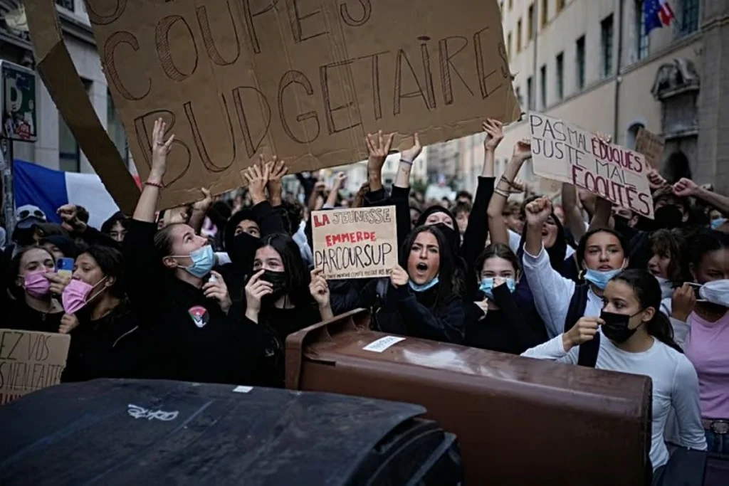 Hundreds of French schools closed as dozens hurt in student protests
