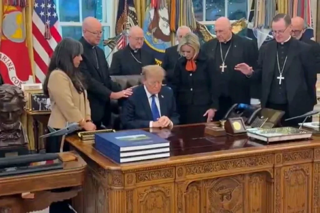 Catholic bishops apologize after video shows them praying over Trump